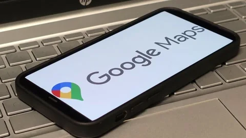 Google Maps web mapping service logo displayed on mobile phone Stock Footage 324705252