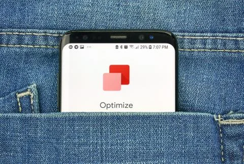 Google Optimize on a phone screen in a pocket Photos