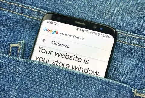 Google Optimize on a phone screen in a pocket 写真素材