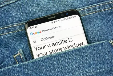 Google Optimize on a phone screen in a pocket Photos