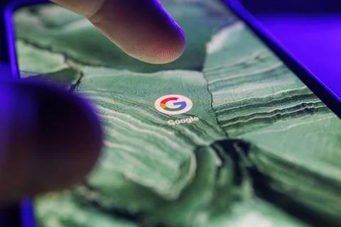 Google search app on smartphone screen. Close up shot of google app Stock Photos