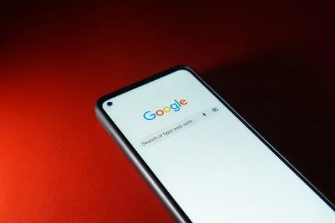 Google search engine logo on smartphone android system. Stock Photos
