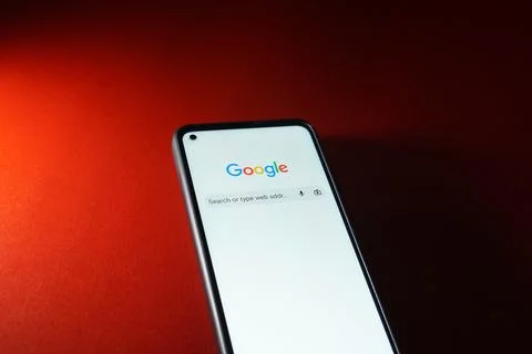 Google search engine logo on smartphone android system. Stock Photos