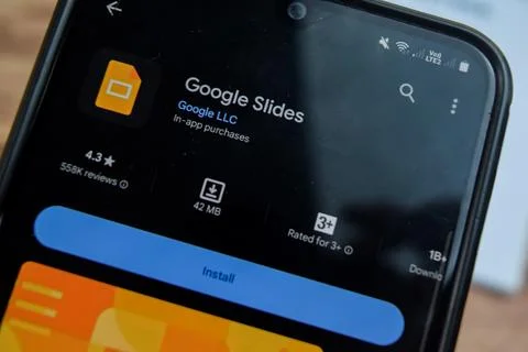 Google Slides application on Smartphone screen. Google Slides Stock Photos