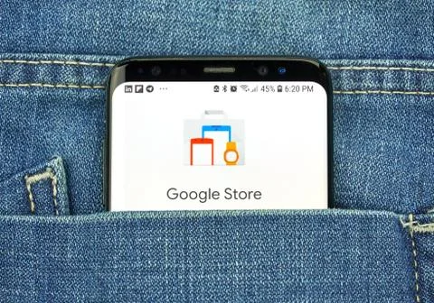 Google Store on a phone screen in a pocket Фото
