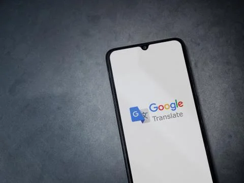 Google Translate app launch screen with logo on the display of a black mobile Stock Photos
