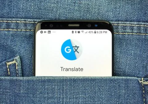 Google Translate app on a phone screen in a pocket Photos