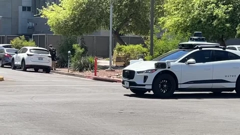 A Google Waymo vehicle stopped at an intersection Stock Footage 238850123