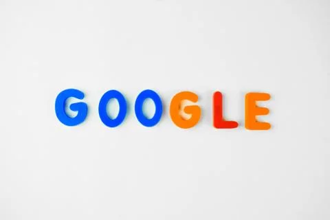 GOOGLE written in different colored letter blocks on a white background Stock Photos