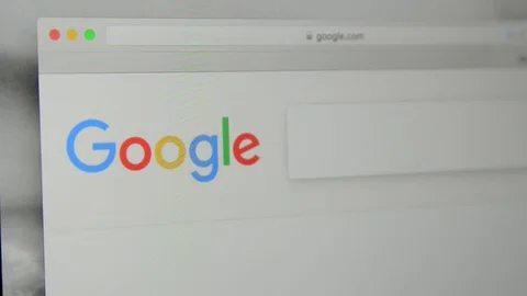 Google.com homepage. Typing word “search” in Google's search bar. Stock Footage 77759550
