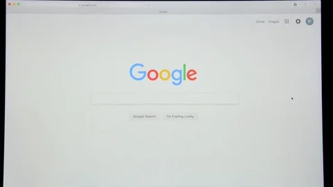 Google.com homepage. Typing word “wikipedia” in Google's search bar. Stock Footage 77759647