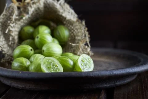 Gooseberries on dark background Stock Photos