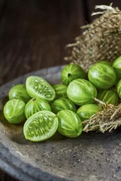 Gooseberries on dark background Stock Photos