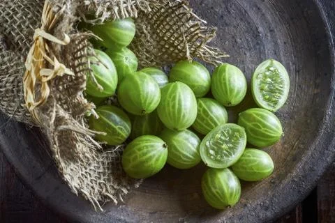 Gooseberries on dark background Stock Photos
