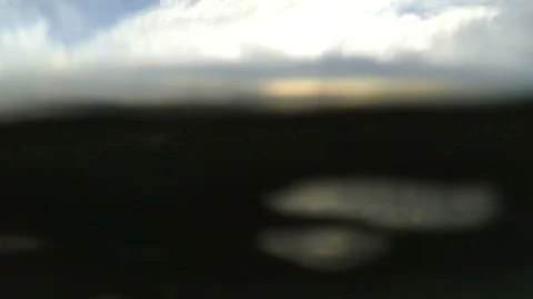 Gopro camera gliding over and under the water level Stock Footage 144475203