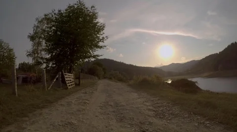 GoPro mounted on front of the car while driving towards the sunset Stock Footage 94972632