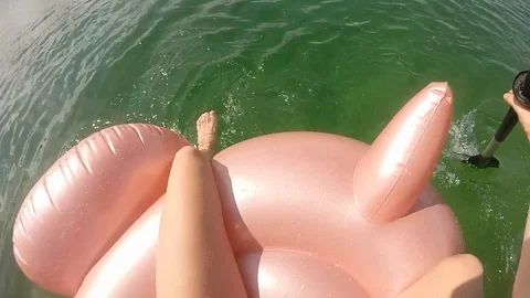 Gopro Paddling on Pink Float Stock Footage 91233875