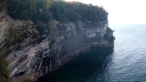 GoPro Pan of forest to cliff edge of Lake Superior Stock Footage 81761361