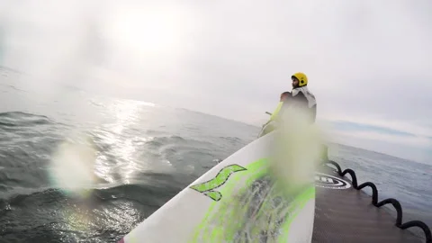 Gopro of pro surfer being pulled out from ocean by team on jet ski Video stock 160496750
