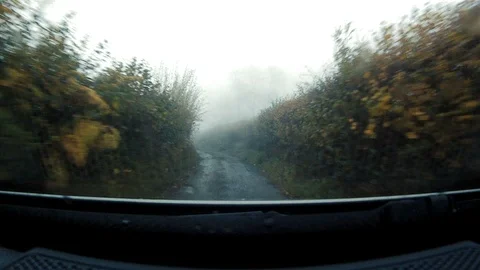 GoPro shot from dash of fast moving 4x4 along British country lane Stock Footage 117862568