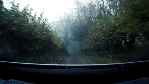 GoPro shot from dash of fast moving 4x4 along British country lane 5 Stock Footage 117862652