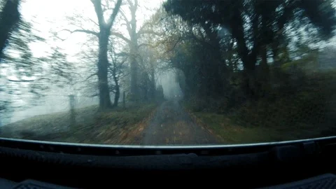 GoPro shot from dash of fast moving 4x4 along British country lane 6 Stock Footage 117863066