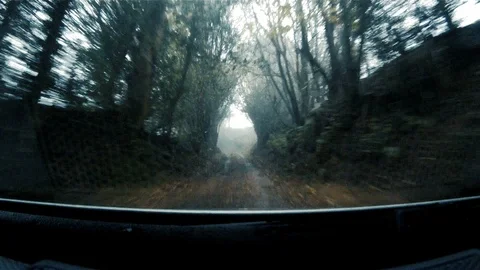 GoPro shot from dash of fast moving 4x4 along British country lane 8 Stock Footage 117863127