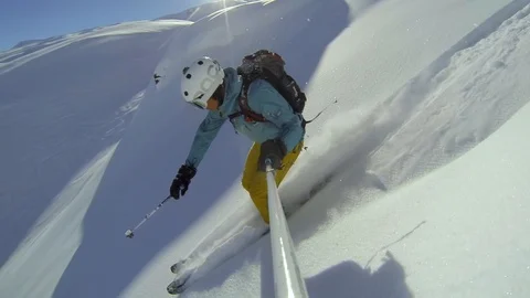 GoPro skiing in powder snow triggering Stock Video Pond5