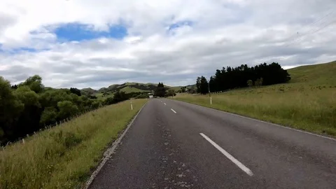 Gopro timelapse, driving through New Zealand streets, green landscape, 4K Stock Footage 107348214