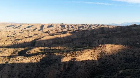 Gorafe badlands creating dramatic shadows in semi desert landscape Stock Photos