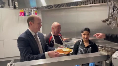 Gordon Lyons visits the People’s Kitchen Belfast  Stock Footage 297955011
