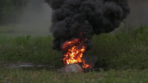 Gorenje large smoke bombs, large and dense clumps of black smoke, slow motion Stock Footage 221105205