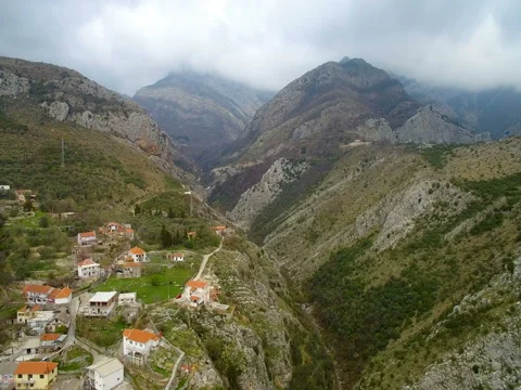 Gorge between mountains and clouds on top Stock-Footage 74689049