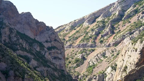 Gorge between the mountains with the road Stock Footage 115158090