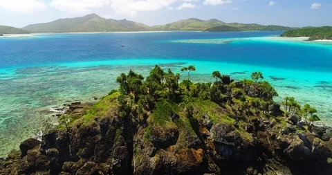 Gorgeous Aerial Orbit of a Tiny Rock Island in the Fiji Islands Video stock 98847829