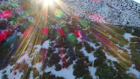 Gorgeous aerial video with sunflare of snowy mountains Stock Footage