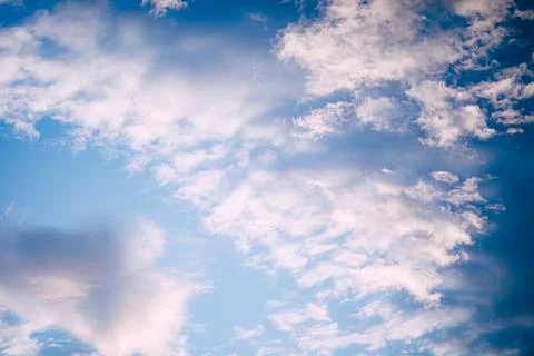 Gorgeous big white clouds float above the sky Stock Photos