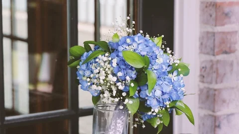 Gorgeous bouquet on the windowsill. Wind blows curtains. Stockbeeldmateriaal 115547438