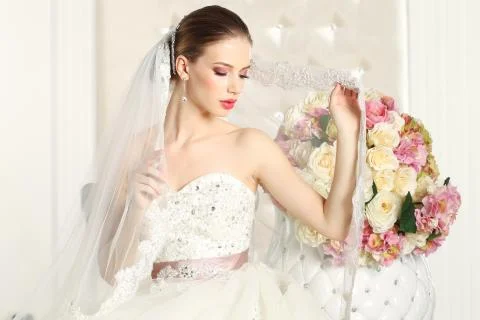 Gorgeous bride in a white room, posing Stock Photos