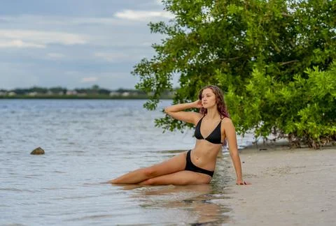 Gorgeous Brunette Bikini Model Posing Outdoors On A Beach Stock Photos