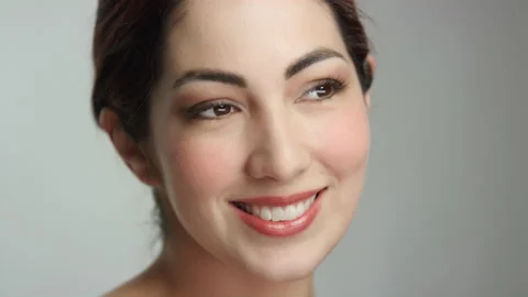 Gorgeous brunette model poses for camera from side angle close up slow motion Stockbeeldmateriaal 193913993