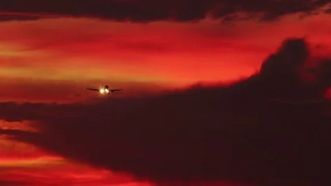 Gorgeous cloudscape with airplane. Flight of plane with flashing lights Stock-Footage 73126836