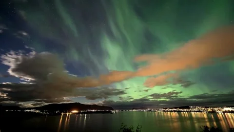 Gorgeous display of the Aurora Borealis casting an ethereal glow over a snowy 스톡 동영상 334658722