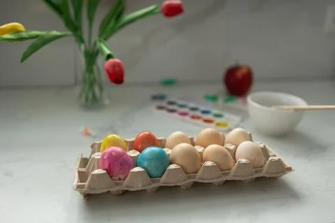 A gorgeous display of Colorful Easter Eggs alongside a beautiful Floral Stock Photos