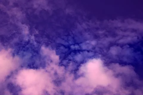 Gorgeous dramatic sunset sky with pink and purple clouds. Stock Photos