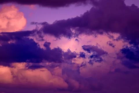 Gorgeous dramatic sunset sky with pink and purple clouds. Stock Photos