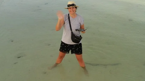 Gorgeous drone pilot waving Stock Footage 102934236