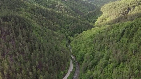 A GORGEOUS DRONE SHOT BETWEEN GREEN MOUNTAINS Stock-Footage 76798538