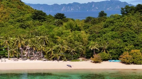 Gorgeous drone shot of Coco Beach, highlighting its scenic beauty and peaceful Stock Footage 295914003