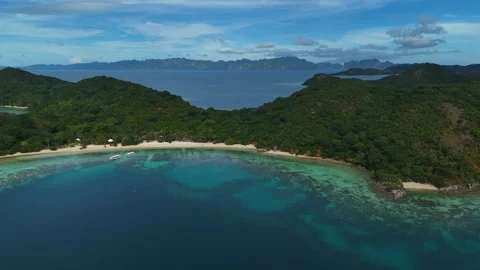Gorgeous drone shot of Coco Beach, highlighting its scenic beauty and peaceful Stock Footage 295914445